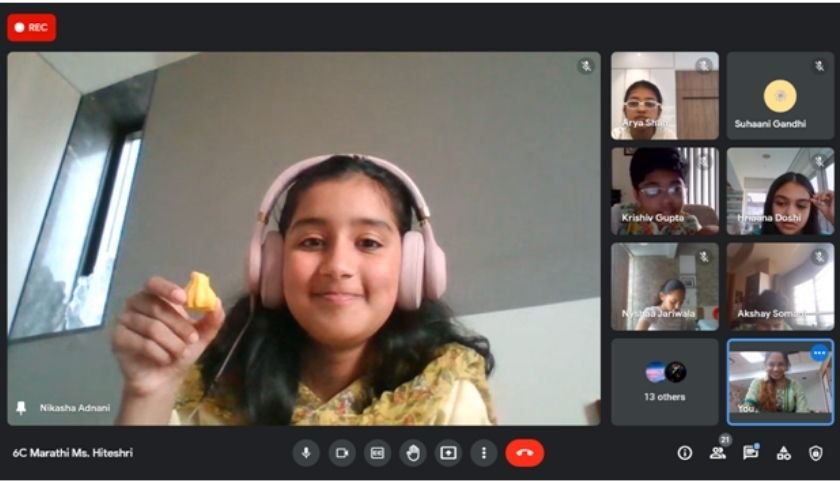 Smiling Nikasha with modak!