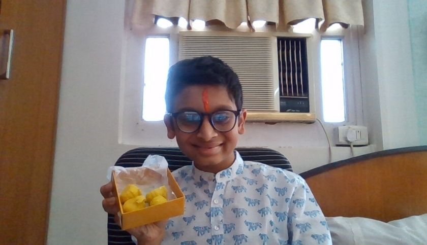 Vivaan Bubna smiling cheek to cheek with his modaks!